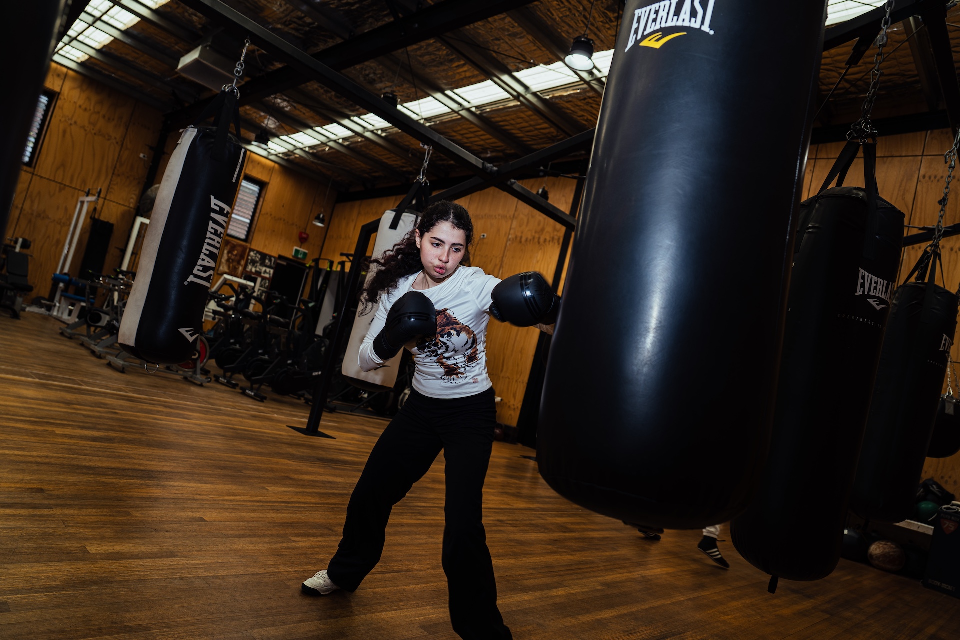 Boxer throwing a straight right on the heavy bag